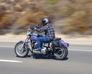 Photo of man on motorcycle with saddlebags installed